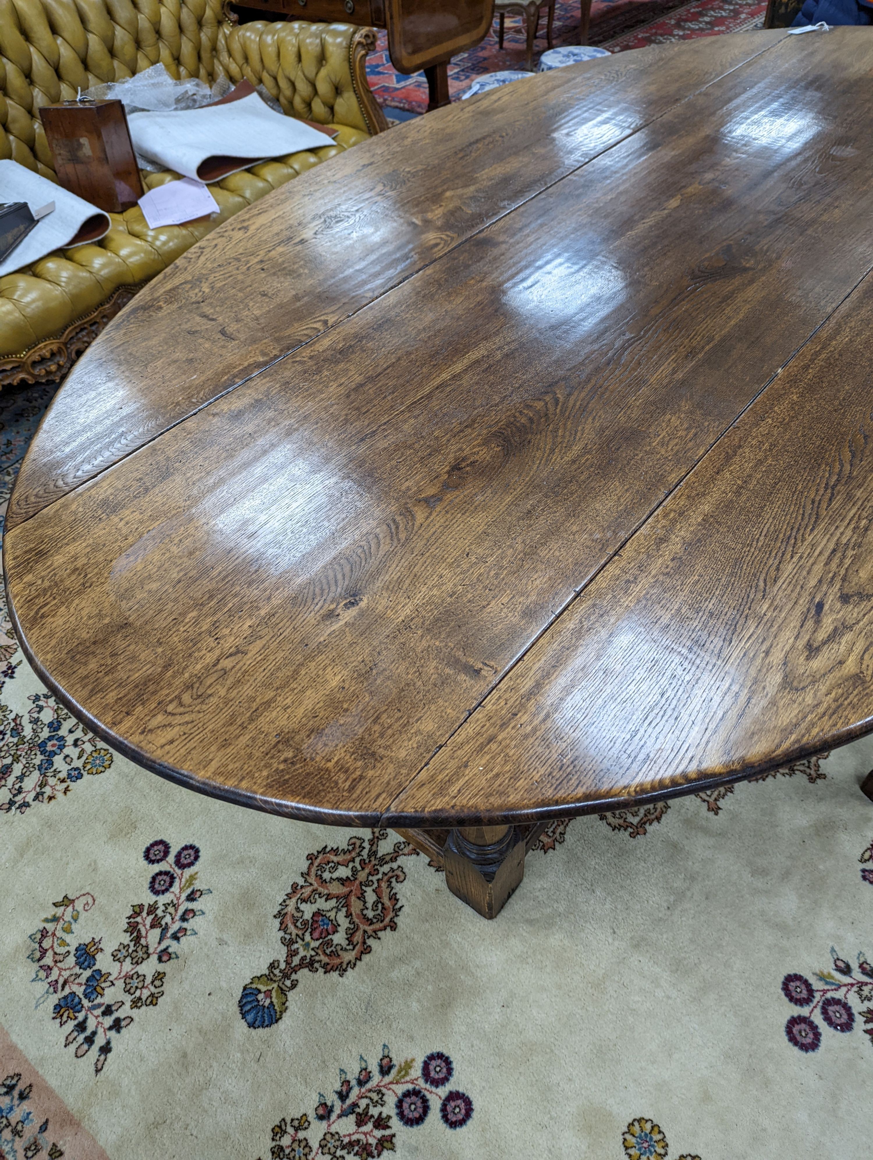 An 18th century style oak gateleg wake table, length 250cm, width 154cm extended, height 75cm